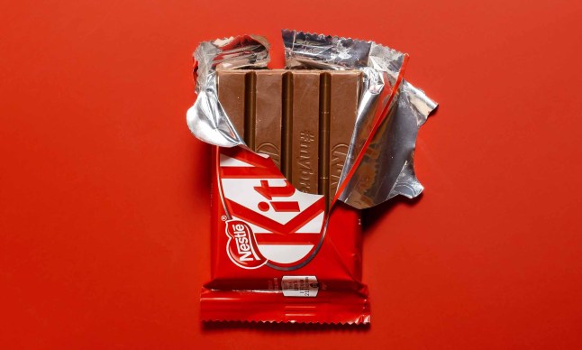 Kitkat chocolate bar in open wrapper.