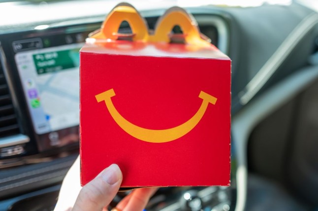 Mcdonalds Happy Meal box, in a car