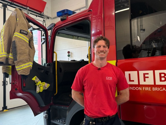 Ben Wiles stood next to a fire engine at Dockhead Station
