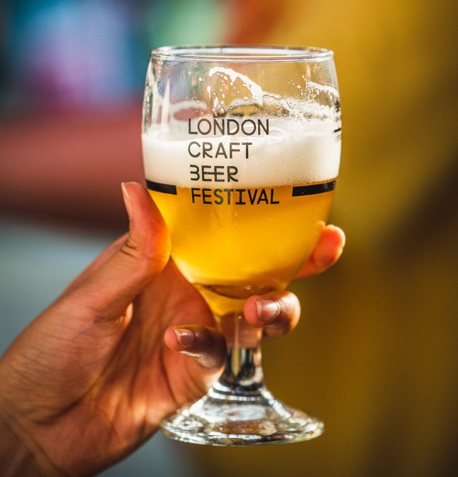 A person holding beer