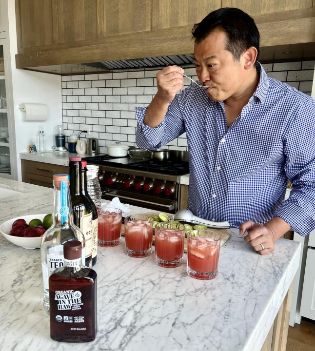 Luke Sung tasting a collection of drinks